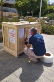 The Infinity Pack & Ship project management team reviewing logistics plans on an industrial site in Israel.