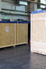 Close-up of heavy-duty rigging equipment being used by the Infinity Pack & Ship team to move industrial machinery.