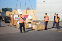 Interior view of a factory relocation project managed by Infinity Pack & Ship, with a production line segment being prepared for transport.