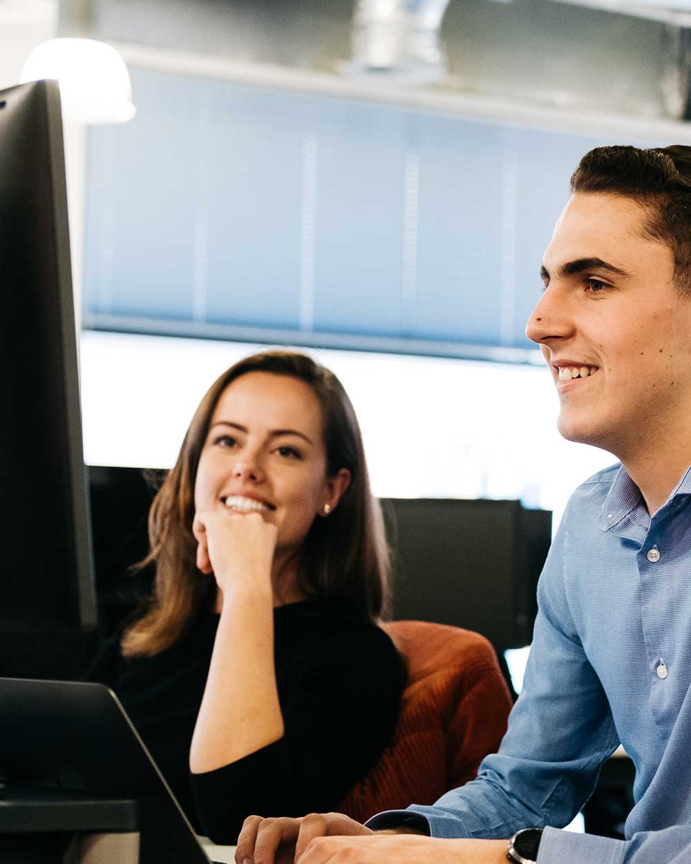 2 people setting up recruitment website
