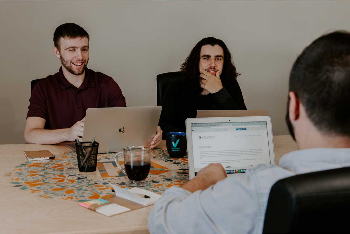 3 people meeting to create candidate personas