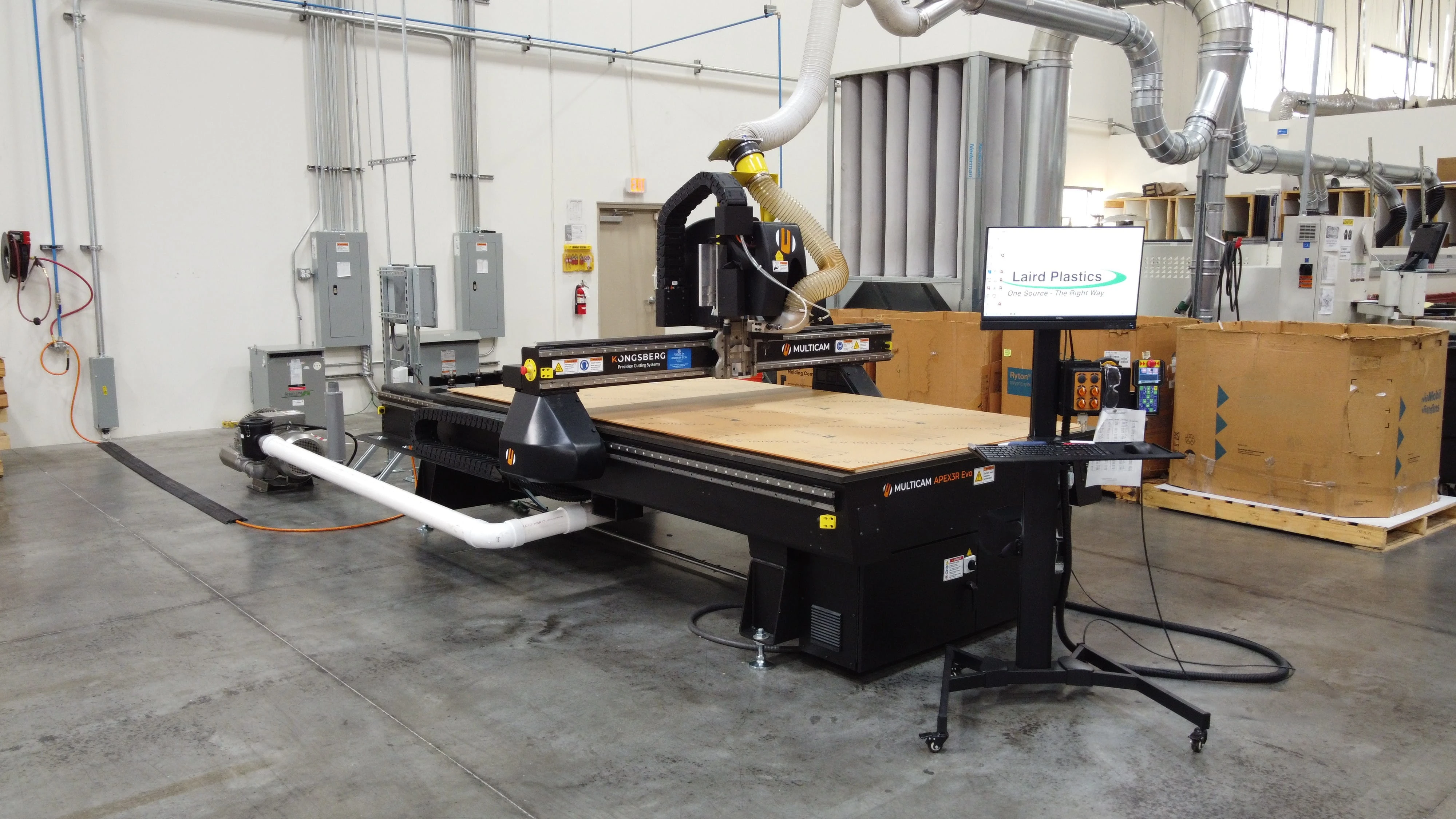 CNC Router cutting plastic sheets at Laird Plastics Las Vegas for precision sign and graphics fabrication