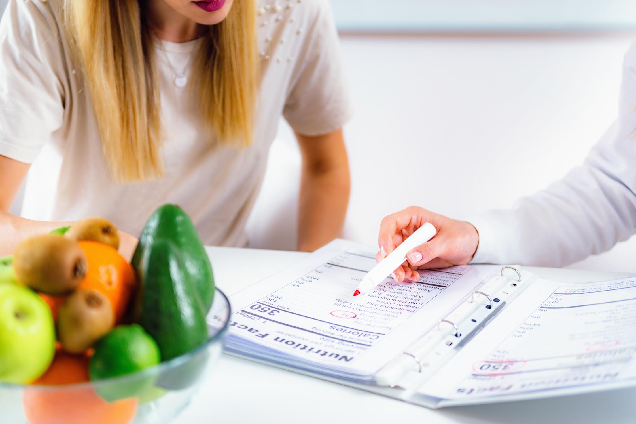 A dietitian discussing nutritional results with a client