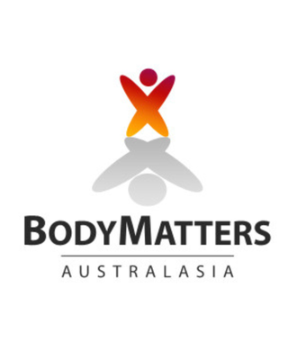 A colorful abstract figure with outstretched arms is reflected below the text "BodyMatters Australasia" on a white background.