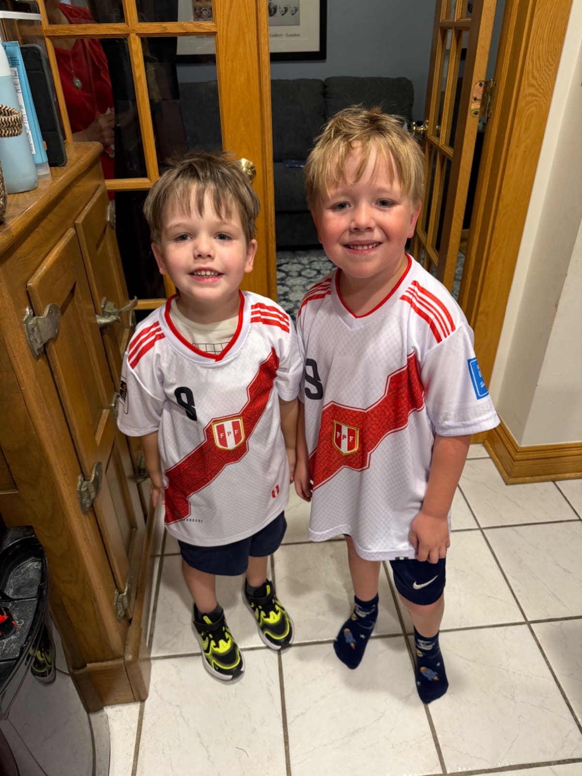 Owen and Ryan wearing Peruvian soccer jerseys