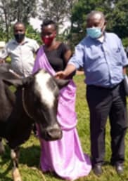 Anothiata Nyirashirambere is awarded a cow in recognition of her reconciliation work within her community.
