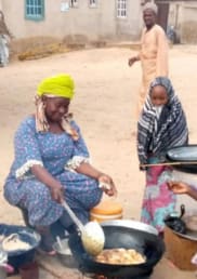 Nigerian women cooking together