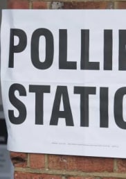 Photo of a women at a polling station in the UK