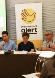 A Filipino man speaks to a meeting