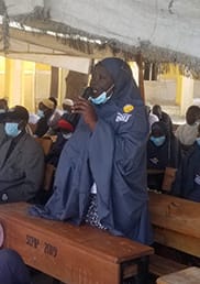 Woman participant of the Zaman Lafiya Hakin Mu (Peace is our obligation) project talking at a meeting with community leaders and security providers