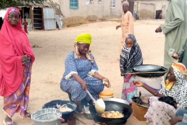 Nigerian women cooking together