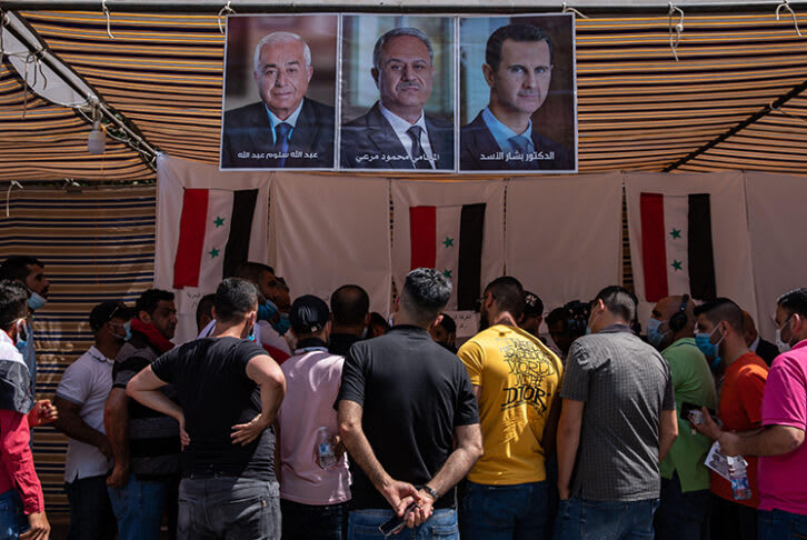 A crowd of Syrian nationals living in Lebanon gather at the Syrian Embassy in Yarze, east of Beirut, waiting to cast their votes in the country's presidential election.