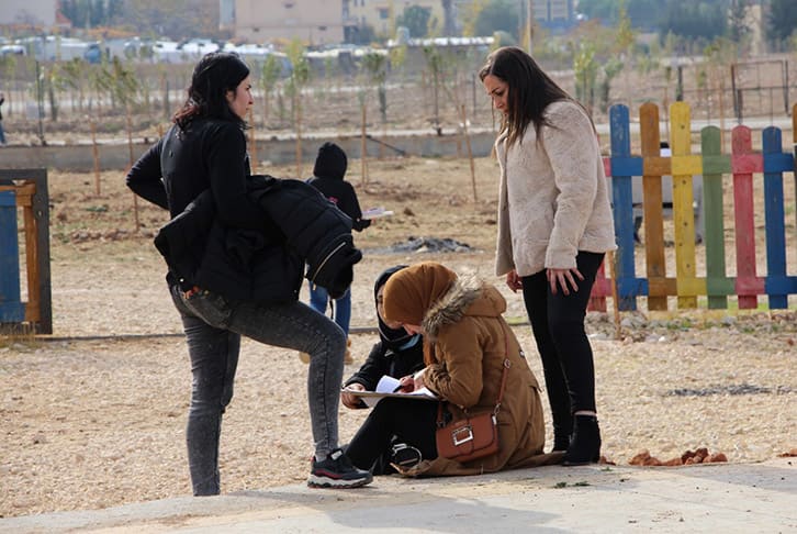 A youth dialogue group in Bekaa, eastern Lebanon, do an assessment of a site selected for ‘placemaking’, which is about reimagining and reinventing an existing public space. © Ghina Kanawaty/Catalytic Action