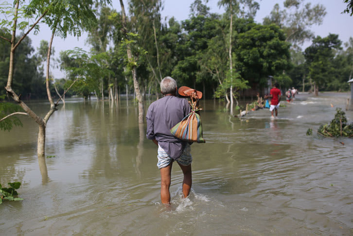 Man wades through water