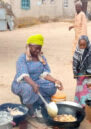 Nigerian women cooking together