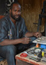 A man at his workshop with tools.