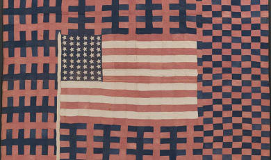 Flag Quilt photo showing an American flag made from feed sacks. 