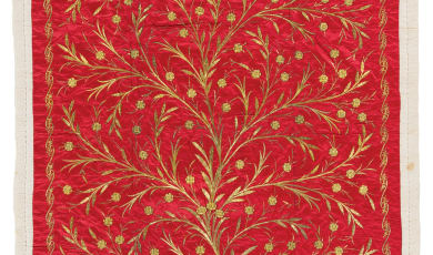 Yorgan quilt photo showing gold decals on a red background. 