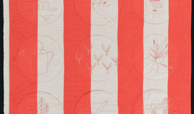 New Life quilt photo with alternating orange and white stripes.