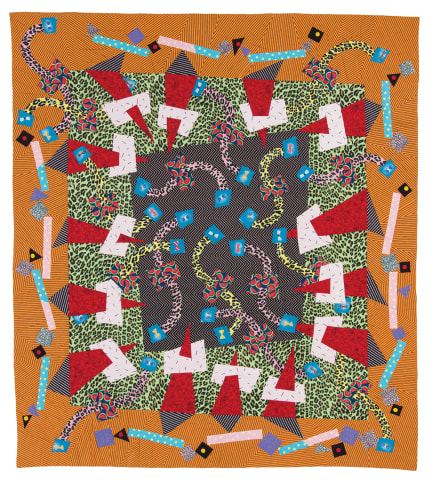 New Year's Eve Party quilt photo showing printed fabrics on an orange background. 