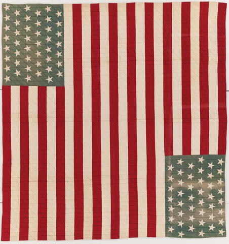 A quilt with a layout of two American flags