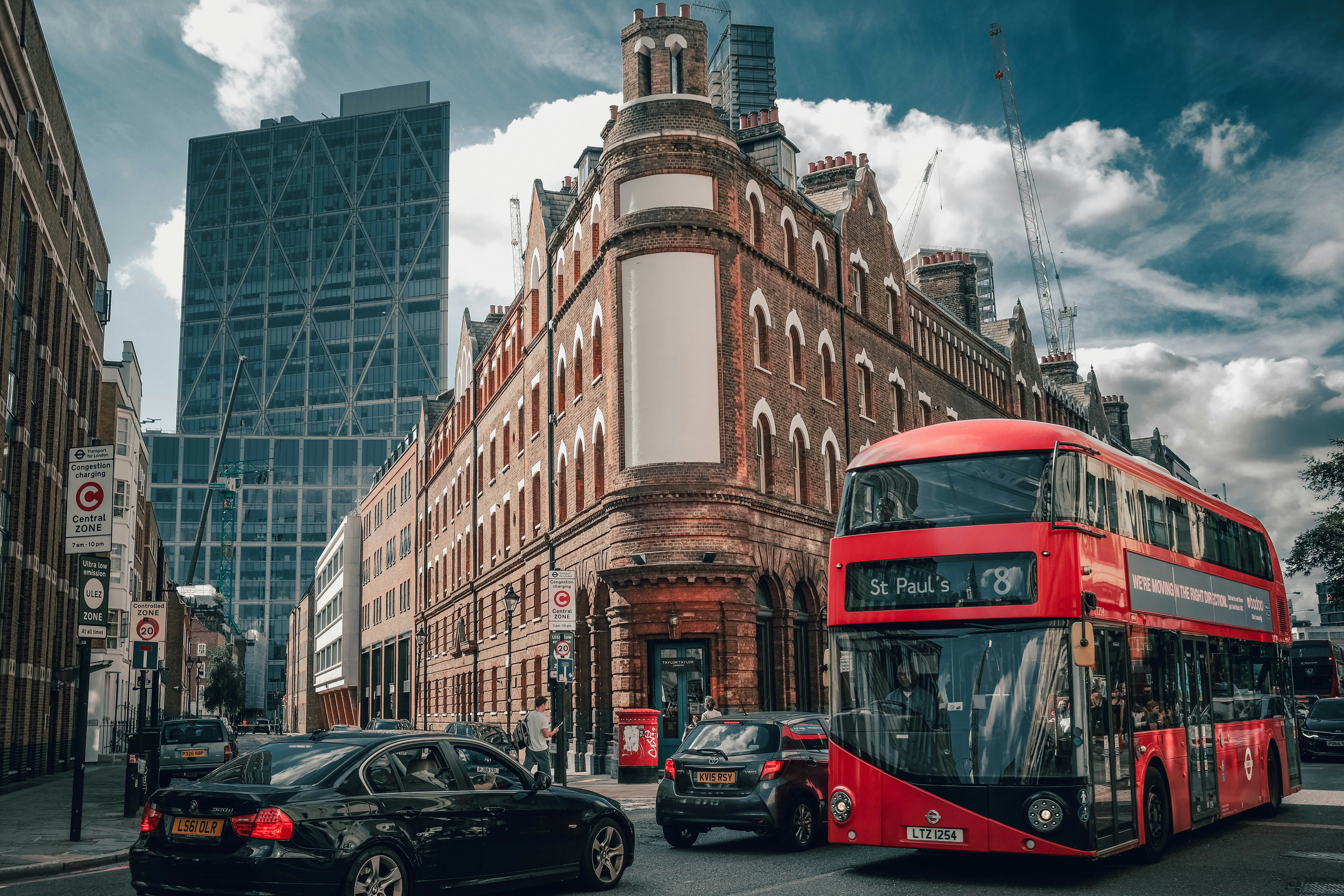 A red double-decker bus on a London street near Shoreditch