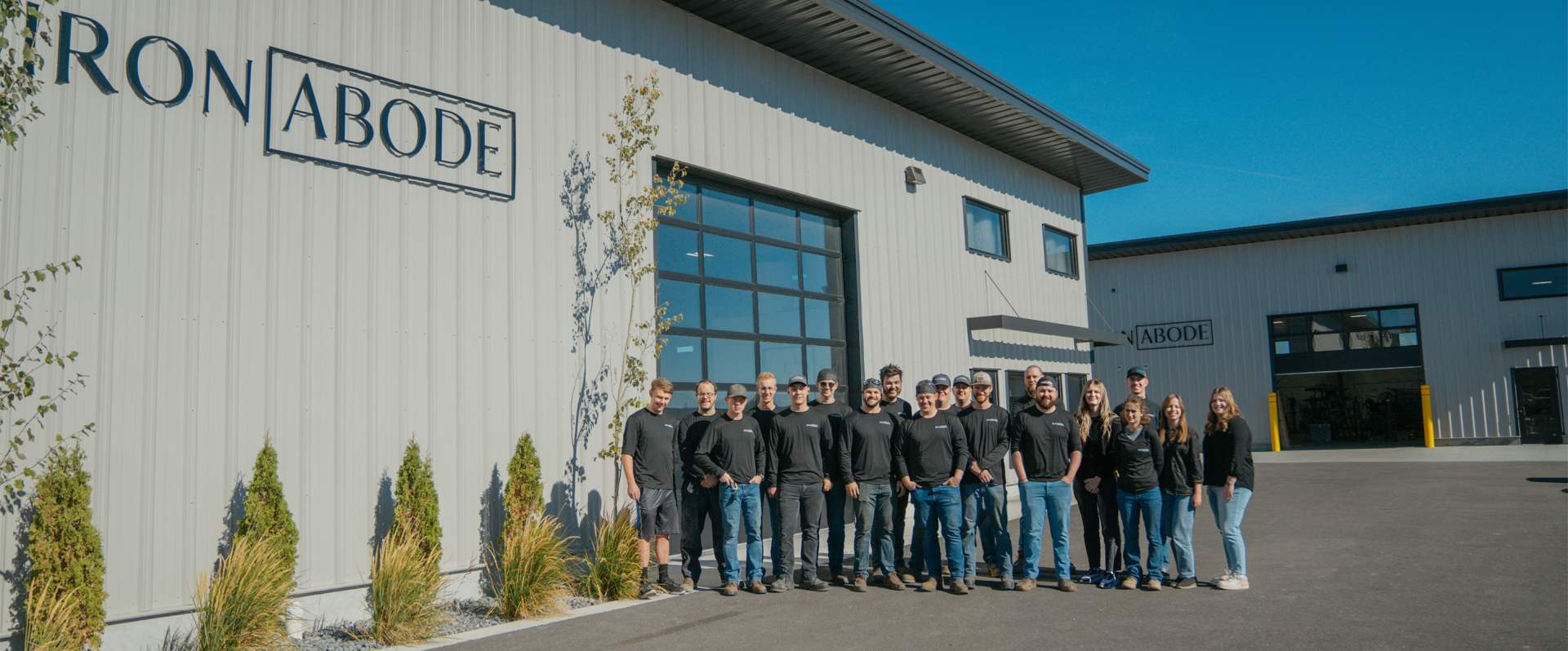 Iron Abode team in front of factory