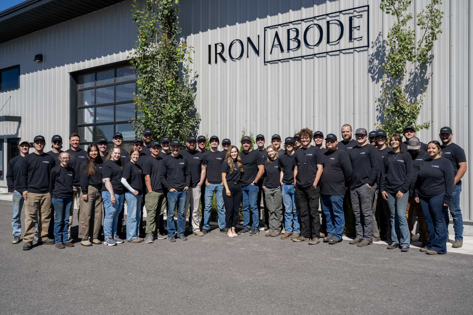 Iron Abode team in front of the factory