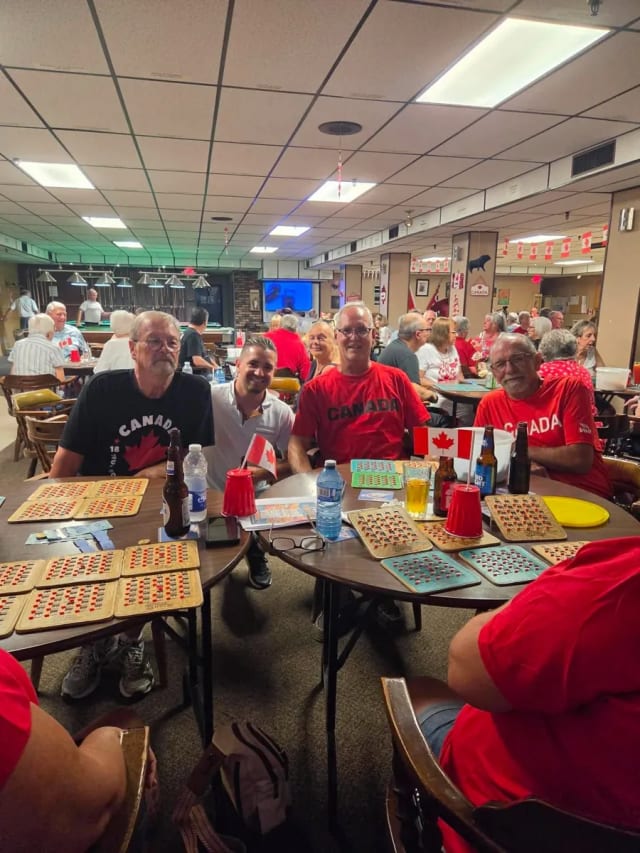 Brandon carrying his son on his shoulders outdoors