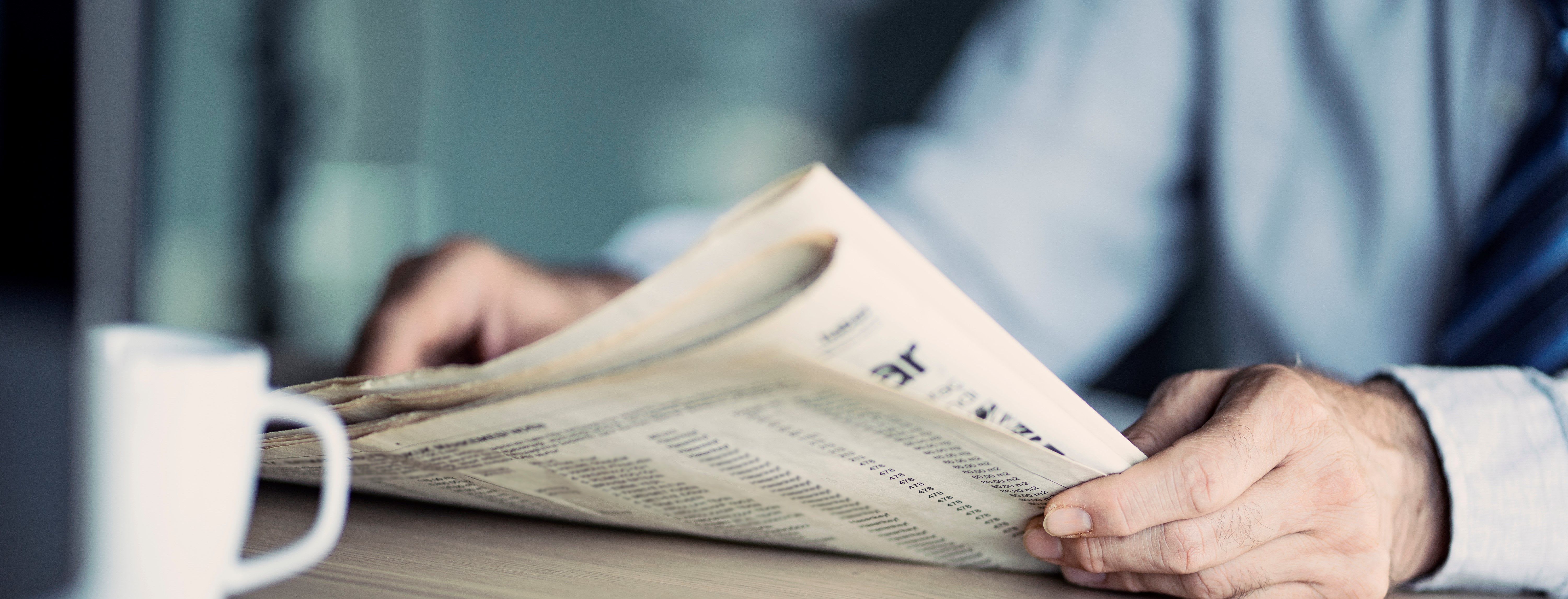 man with newspaper