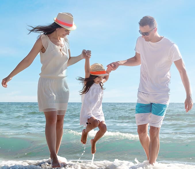 A family of four on the coast