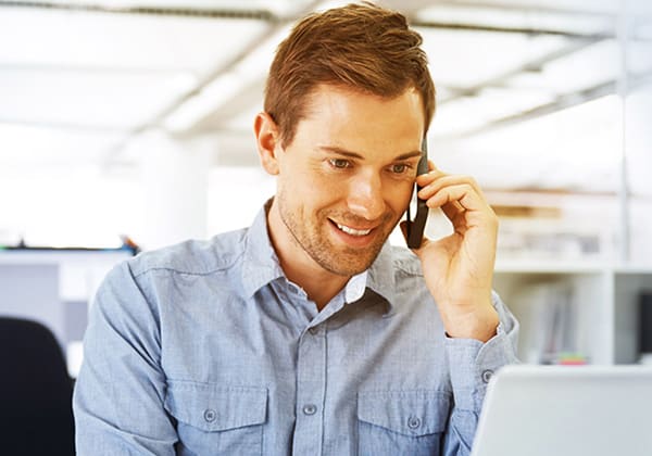 A man arranges property insurance by the phone