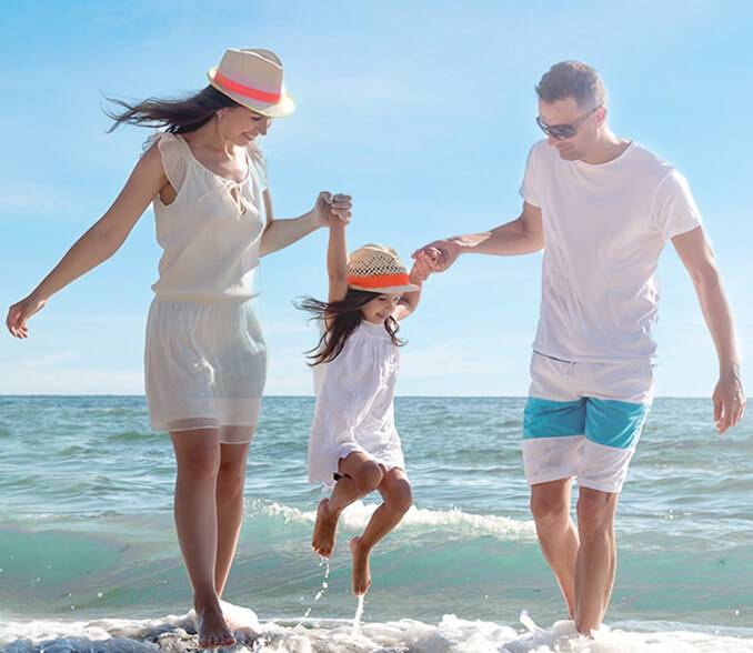 A family of four on the coast