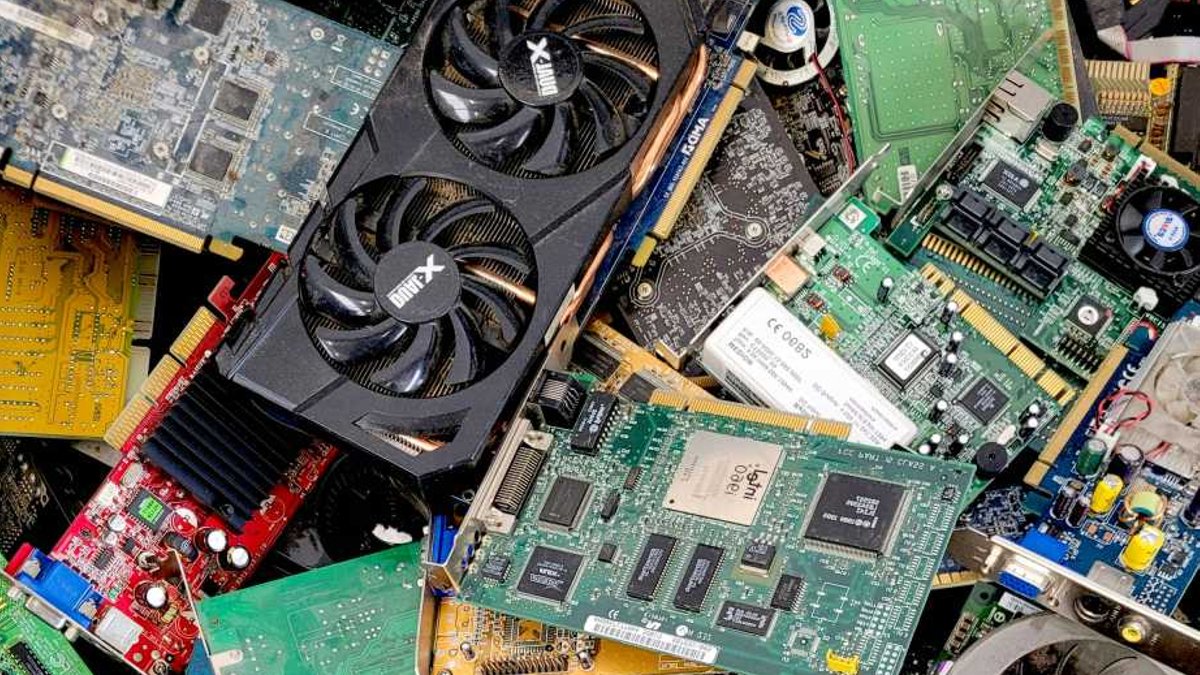 Used PC components hardware e-waste in a dump recycle.