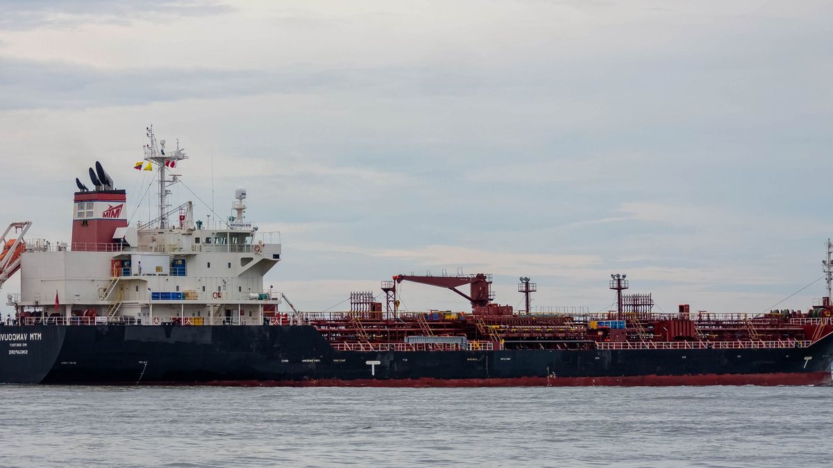An oil tanker sailing on the open sea, ideal for maritime and logistics concepts.