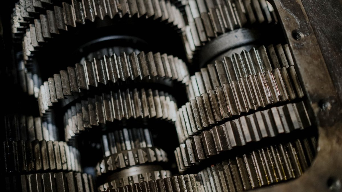 Detailed shot of mechanical gears showcasing intricate steel parts and engineering precision.