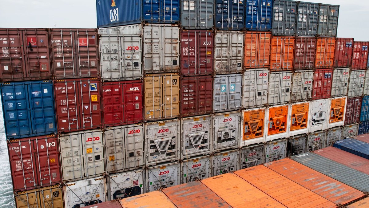 Nordstrom tests weekend deliveries and faster shipping options Colorful stacked shipping containers on a cargo ship traveling at sea, showcasing global trade.