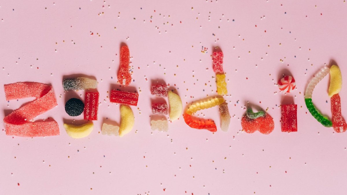 Moving to Wealthier Areas Cuts Diabetes Risk Candies shaped to spell diabetes on a pink background, highlighting sugar intake.