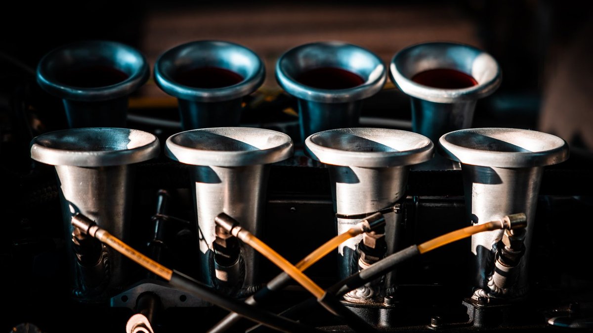 Law Firms Lose Clients at Intake Stage Detailed view of a classic car engine's intake manifold with metal components.