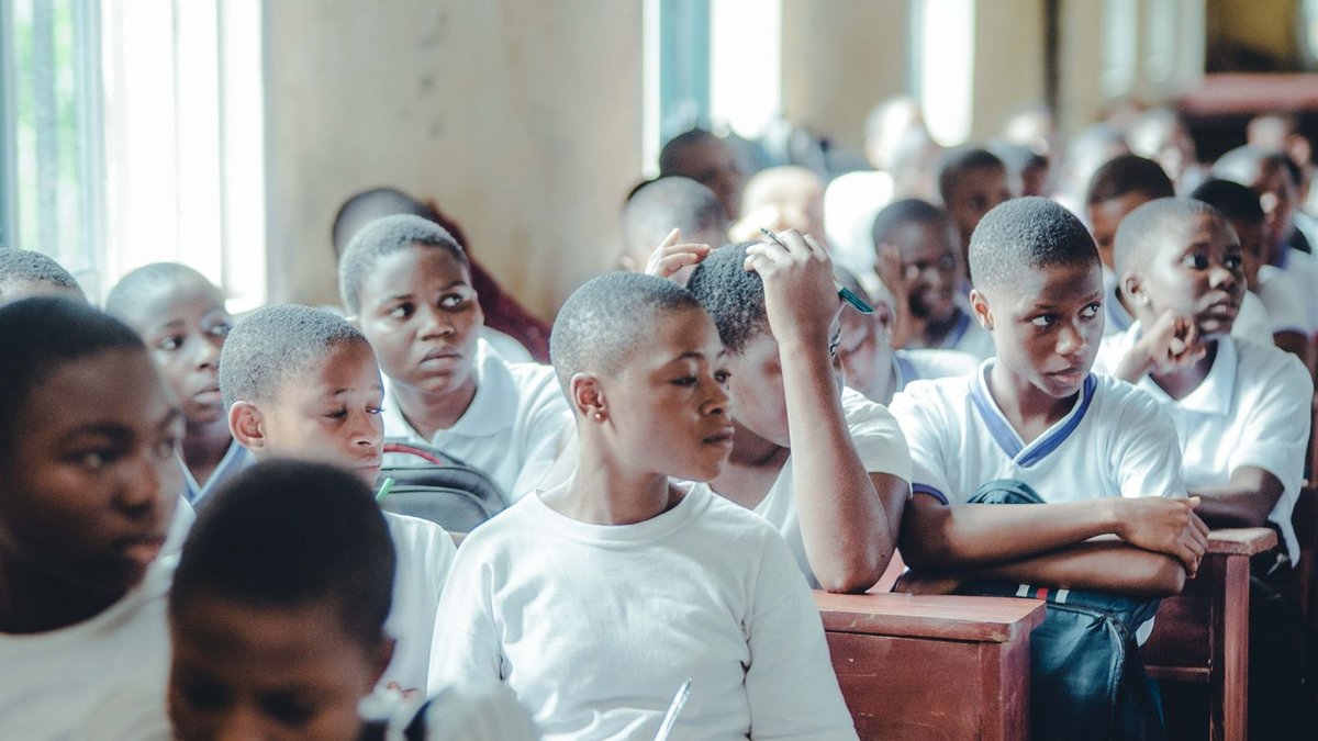 Pupils in a classroom. Furaha says mismatched school-fee deadlines and household income keep children out of school.