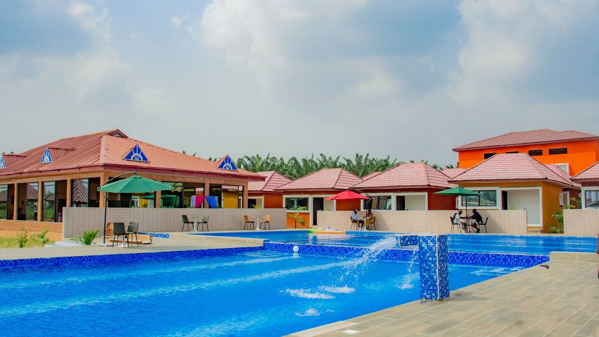 Colorful resort featuring a refreshing swimming pool surrounded by modern architecture.