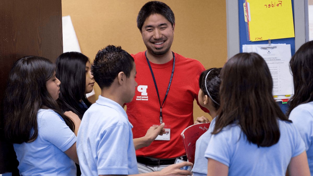 A teacher at Peak Preparatory Academy, a charter school in Dallas, laughs with his 7th-grade Spanish students.