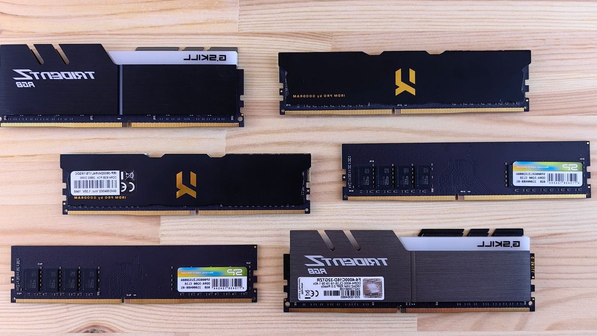 AI chip demand squeezes PC market, shipments fall Top view of various RAM sticks arranged on a wooden surface, showcasing computer memory technology.