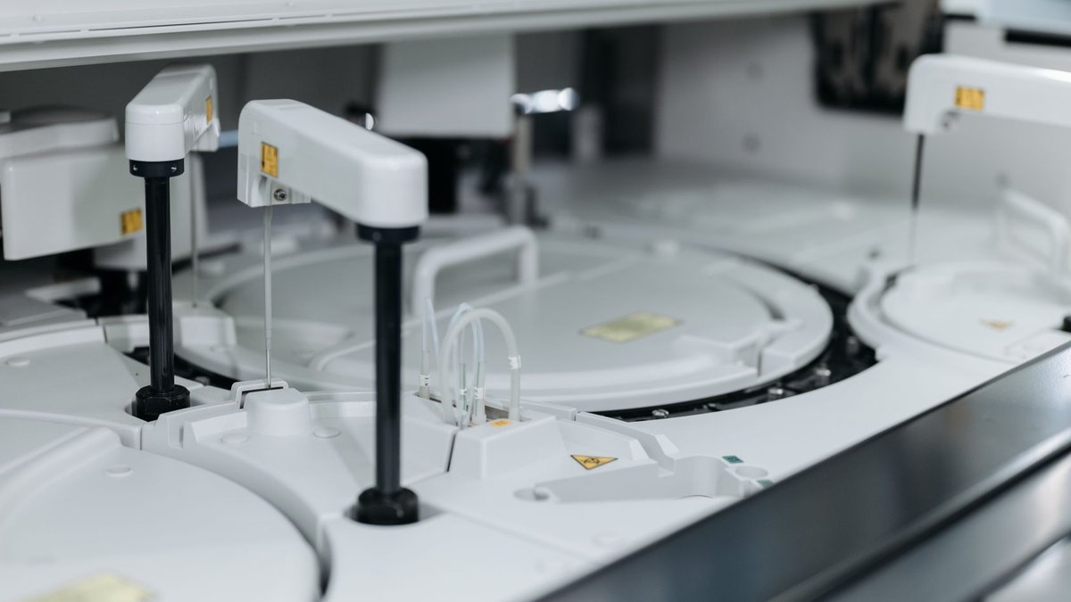 Close-up of advanced laboratory machinery in a medical facility, showcasing precise scientific equipment.