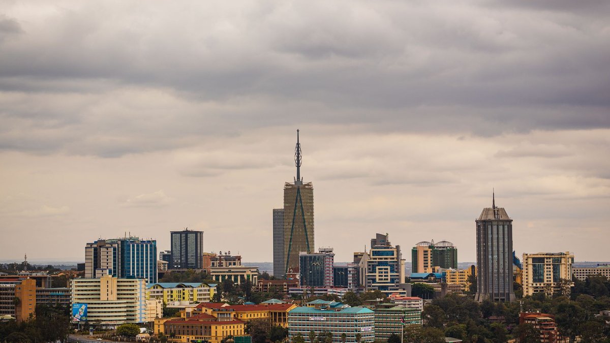 Explore the vibrant skyline of Nairobi with its modern skyscrapers under an overcast sky.
