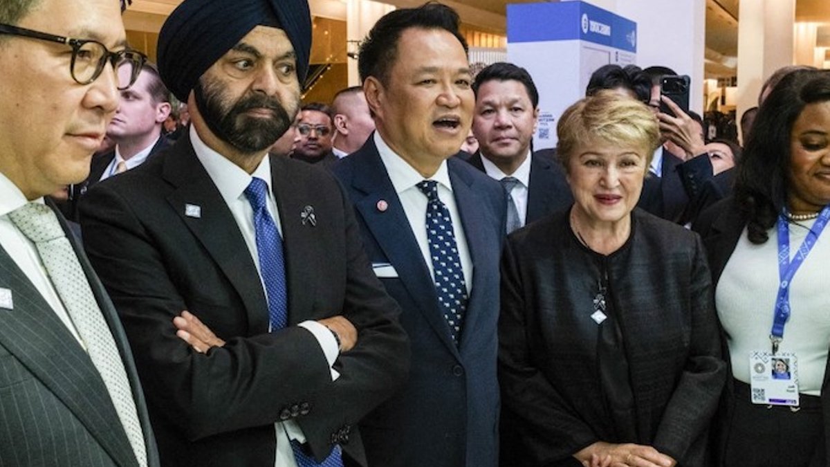 IMF managing director Kristalina Georgieva, Thai PM Anutin Charnvirakul, and World Bank president Ajay Banga stand at the ann