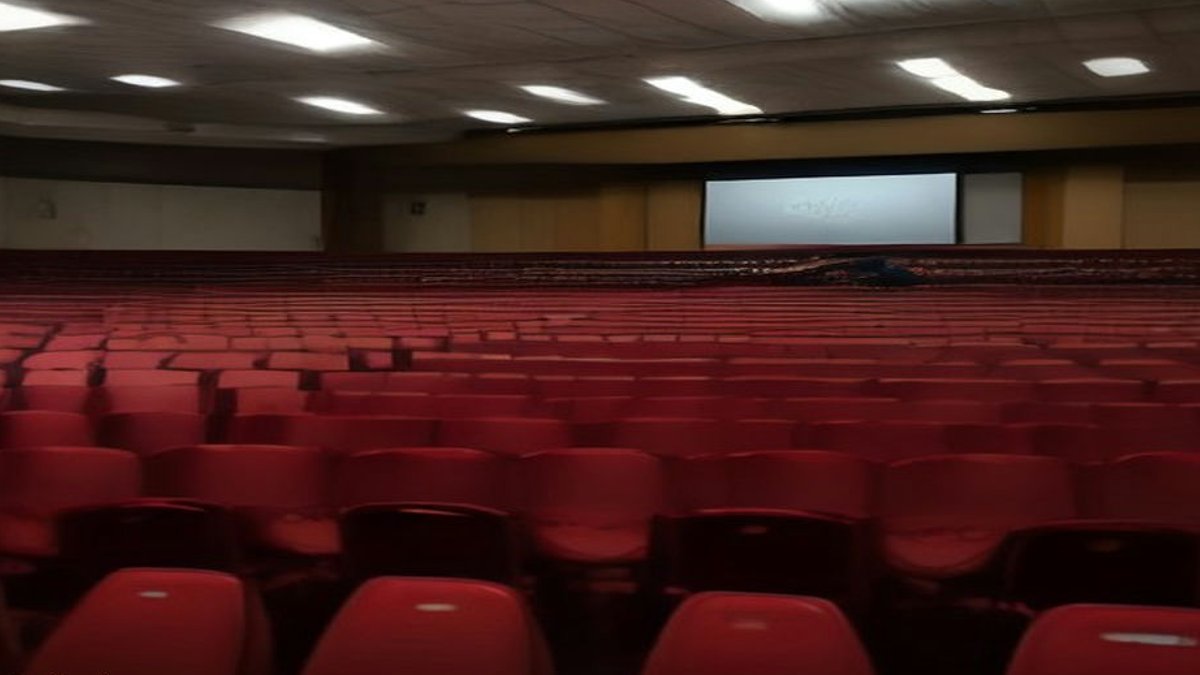 University conference hall audience.