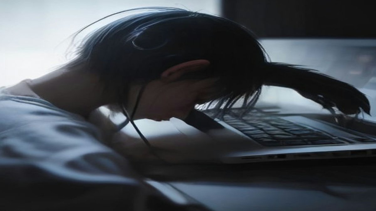 **AI developer typing at laptop**.