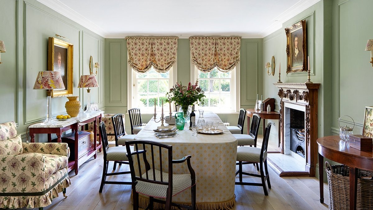Sensitive renovation preserves period charm at historic UK country home A Décors Barbares tablecloth dresses the generous table which is surrounded by antique upholstered chairs.in the dining room.