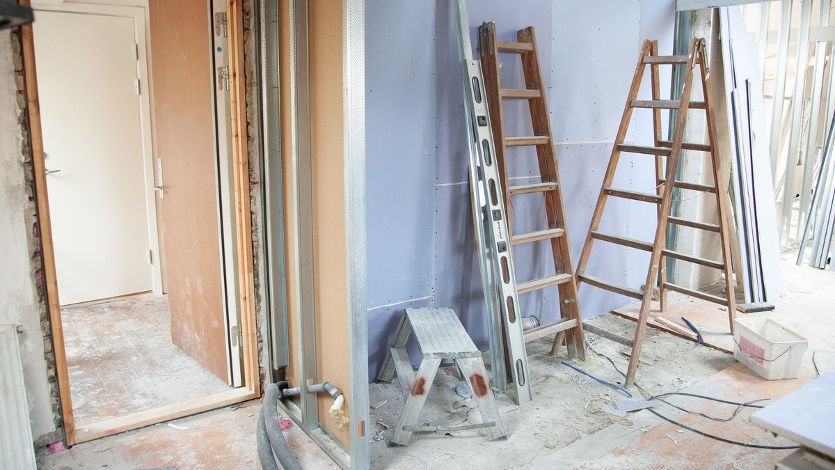 NARI CEO Discusses Remodeling Industry Challenges Construction site featuring ladders and tools in a home renovation setting.